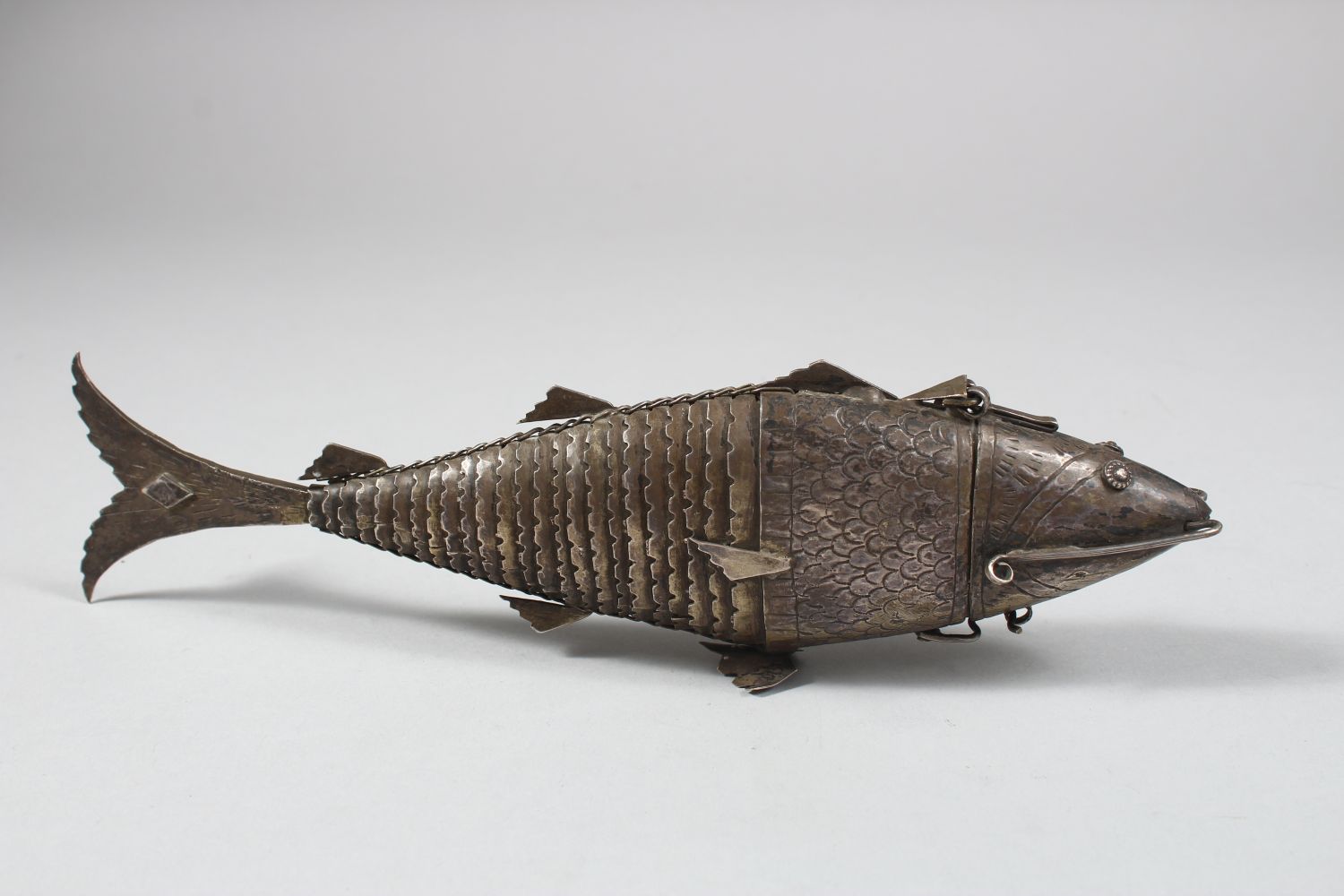 A 19TH CENTURY INDIAN SILVER RETICULATED FISH SHAPED SPICE BOX, the head opening, 25cm long - Image 3 of 6