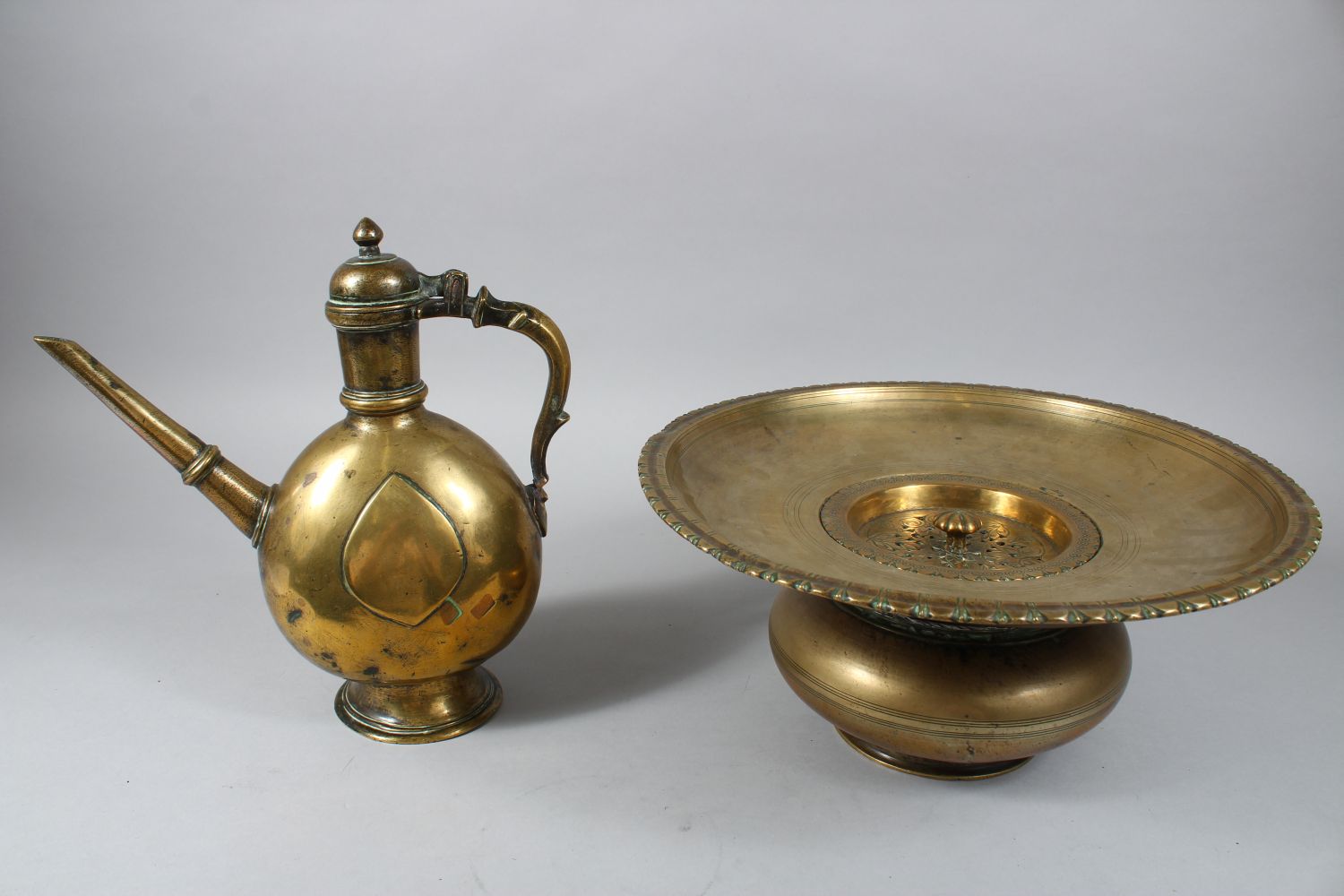 AN 18TH CENTURY MUGHAL INDIAN BRASS EWER & BASIN, the ewer 27cm high x 26cm wide. the basin 15cm - Image 2 of 6