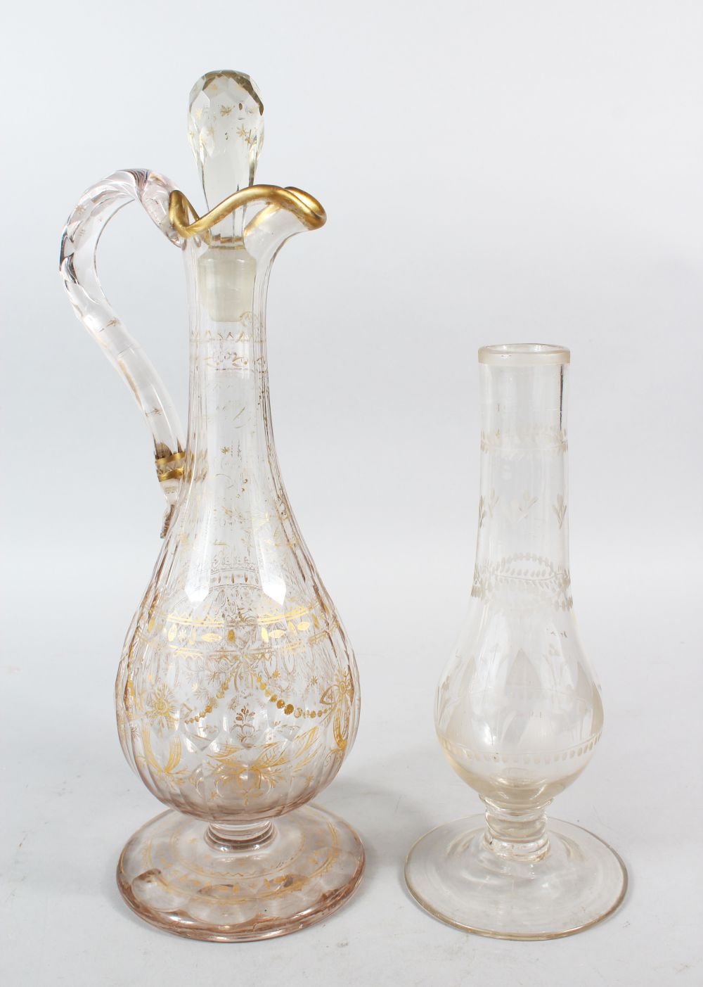 A SUPERB GILT DECORATED CUT GLASS EWER AND STOPPER, 41cm high, together with a cut glass pedestal