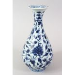 A 19TH CENTURY CHINESE MING STYLE BLUE & WHITE PORCELAIN VASE, decorated with formal scrolling