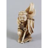 A JAPANESE MEIJI PERIOD CARVED IVORY NETSUKE OF A MAN, himotoshi formed at the rear, 6cm.