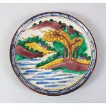 A GOOD JAPANESE MEIJI PERIOD IMARI PORCELAIN PLATE, decorated in four colour decoration to depict
