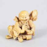 A JAPANESE MEIJI PERIOD CARVED IVORY NETSUKE OF A LAUGHING MAN, the man in a seated position with