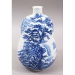 A GOOD 20TH CENTURY JAPANESE BLUE & WHITE ARITA STYLE PORCELAIN DOUBLE GOURD VASE, the body