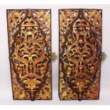 A PAIR OF 19TH / 20TH CENTURY CHINESE CARVED GILT WOOD PANELS, carved with raised floral design,