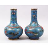 A GOOD PAIR OF LATE 19TH CENTURY CHINESE CLOISONNE BOTTLE VASES, the blue ground with floral