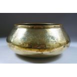 A 14TH CENTURY PERSIAN FARS BRASS BOWL, with calligraphic decoration, 11cm high x 23cm diameter.