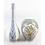 TWO GOOD QAJAR POTTERY VASES, one painted with birds and flowers, 26cm high, the other with four
