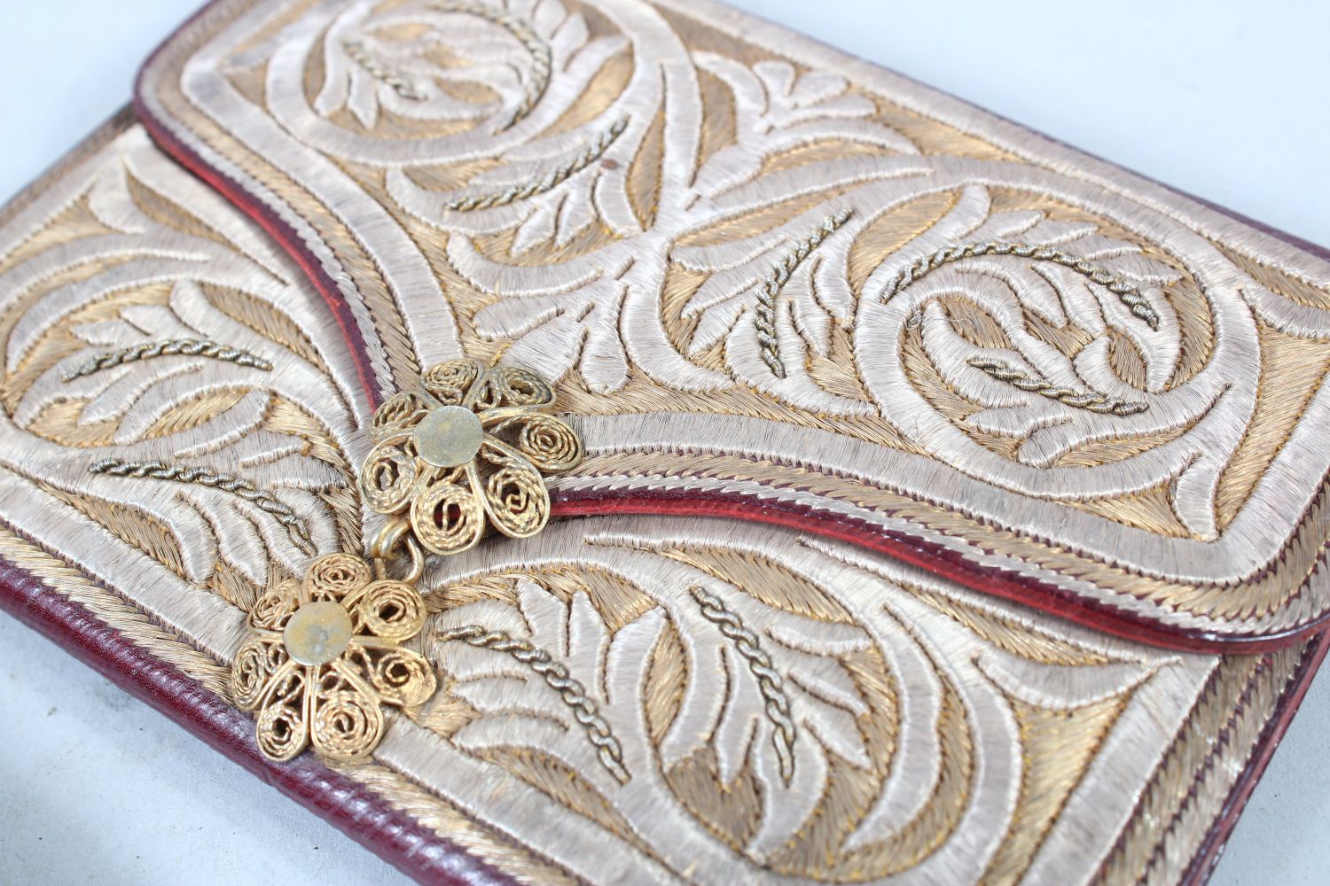 TWO OTTOMAN SILVER THREAD DECORATED LEATHER WALLETS, one dated 1908, 14cm and 10cm wide, (2). - Image 2 of 6
