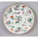 A GOOD 19TH CENTURY CHINESE FAMILLE ROSE FLUTED SAUCER DISH, decorated with scenes of flora, the