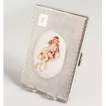 A GOOD ENGINE TURNED SILVER CIGARETTE CASE, the lid with an enamel of a classical nude. Birmingham