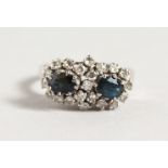 A SAPPHIRE AND DIAMOND RING, set in a white metal mount, unmarked, possibly white gold.