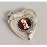 A SILVER AND ENAMEL HEART SHAPE VESTA CASE.