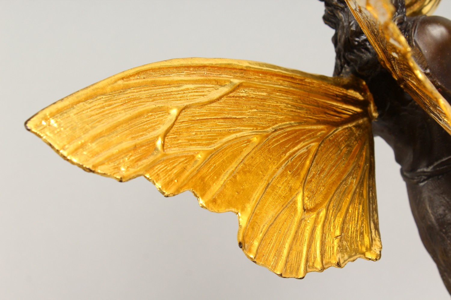 A BRONZE FIGURE OF A FAIRY, 20TH CENTURY, standing holding a shell in her hands, on a marble base. - Image 7 of 9