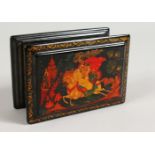 A RUSSIAN LACQUER BOX, decorated with three figures on horseback. 5ins x 3.25ins.