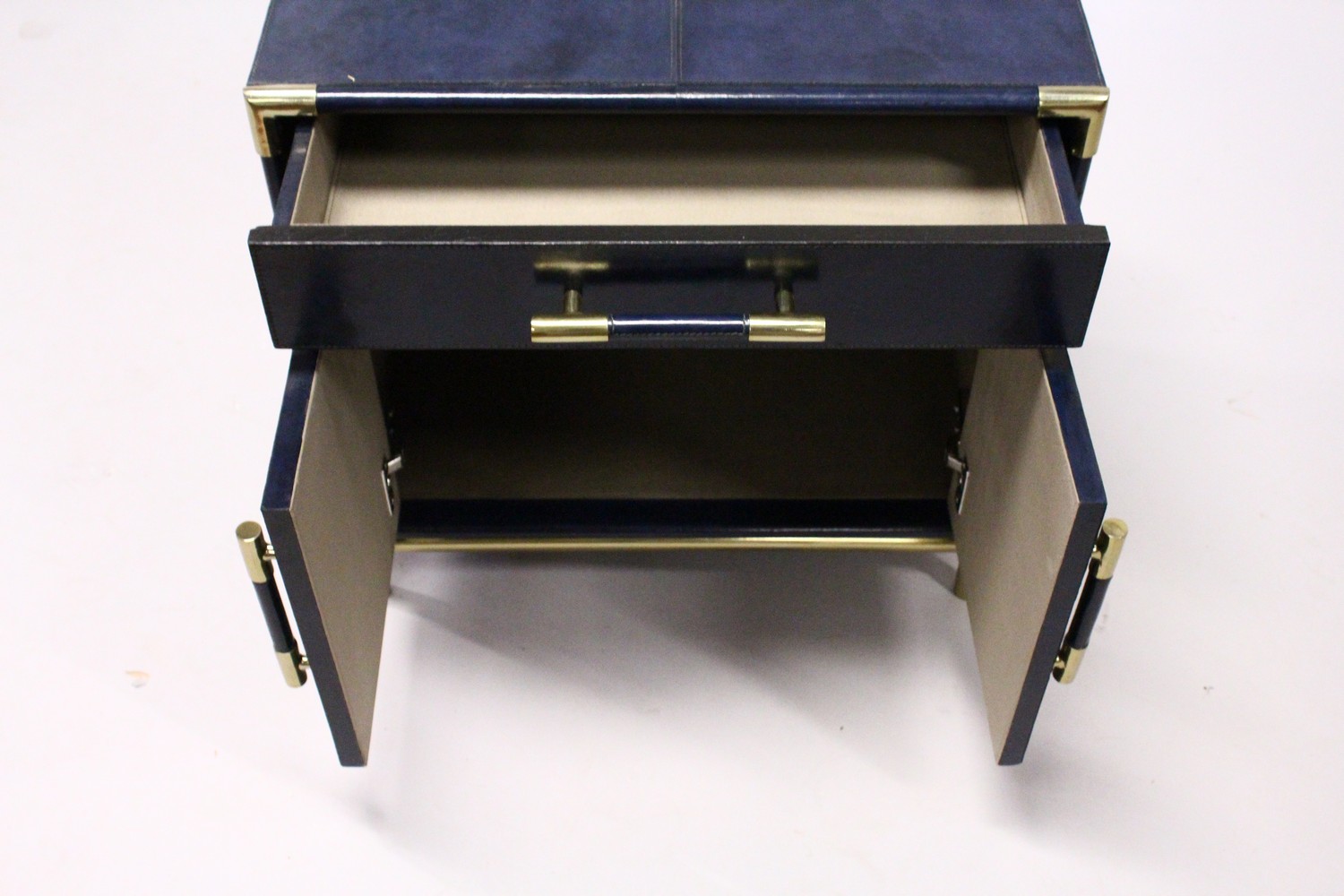 AN UNUSUAL BLUE LEATHER COVERED CHEST, with a long drawer over a pair of doors, on tubular legs. 2ft - Image 3 of 4