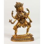 AN EASTERN GILT BRONZE MULTI-ARM DEITY, inset with semi-precious stones. 11ins high.