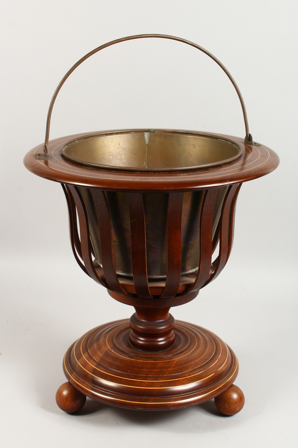 A DUTCH MAHOGANY JARDINIERE, with brass liner. 16ins high.