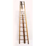 A VERY GOOD VICTORIAN GOTHIC REVIVAL MAHOGANY FOLDING LIBRARY LADDER, with fluted, parcel gilded