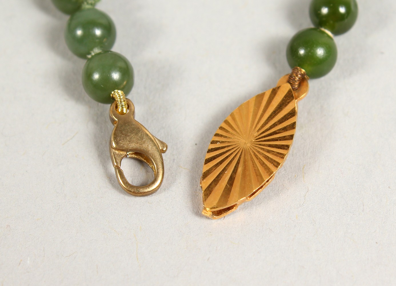 A JADE BEAD NECKLACE, with 9ct gold clasp; together with a similar bracelet. Necklace: 17ins long. - Image 3 of 4