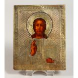 A SMALL RUSSIAN SILVER GILT ICON. Christ. 4.25ins x 3.5ins.