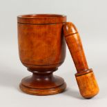 A 19TH/20TH CENTURY PESTLE AND MORTAR, possibly sycamore. Mortar: 9ins high.