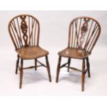 TWO 19TH CENTURY YEW AND ELM WINDSOR DINING CHAIRS, with turned and pierced splats.