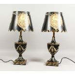 A PAIR OF URN SHAPED TOLEWARE STYLE LAMPS AND SHADES. 22ins high.