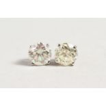 A PAIR OF WHITE GOLD DIAMOND STUD EARRINGS of three quarters of a carat approx.