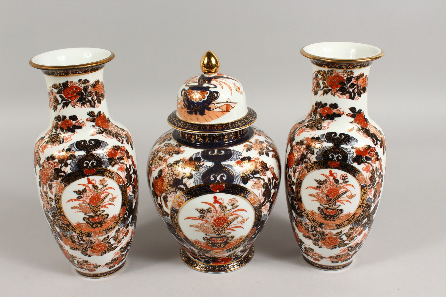 A JAPANESE IMARI GARNITURE, comprising a pair of vases and ginger jar and cover. Vases: 10.5ins - Image 3 of 7