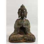 A LARGE CAST BRONZE MODEL OF A SEATED BUDDHA. 16ins high.