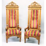 AN IMPRESSIVE PAIR OF OAK "THRONE" STYLE ARMCHAIRS, 20TH CENTURY, the high backs mounted with a