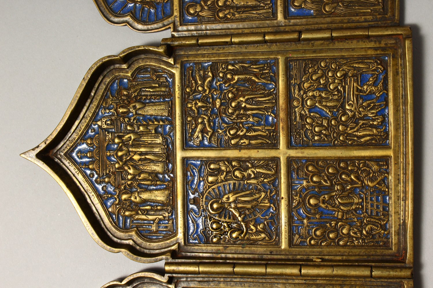 A FOUR PIECE RUSSIAN BRASS AND BLUE ENAMEL FOLDING ICON, with sixteen small panels, 1.75ins square - Image 4 of 11