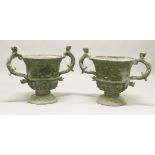 A VERY GOOD LARGE PAIR OF 19TH CENTURY LEAD TWIN-HANDLED PEDESTAL URNS, the handles modelled as
