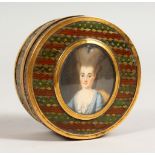 A GEORGE III CIRCULAR BRASS AND ENAMEL BOX, with oval portrait of a lady. 2.75ins diameter.