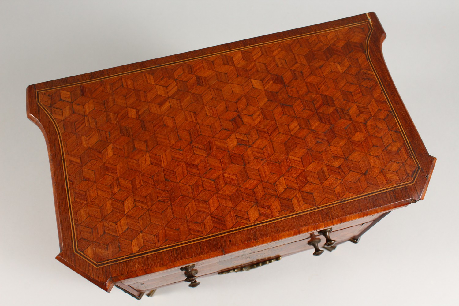 A MINIATURE FRENCH PARQUETRY AND MARQUETRY TWO DRAWER COMMODE, on tapering legs. 12ins wide. - Image 3 of 15