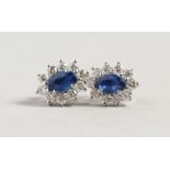 A PAIR OF 18CT WHITE GOLD, SAPPHIRE AND DIAMOND EARRINGS of 1CT approx.
