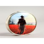 A SILVER OVAL PILL BOX, the lid with an enamel, lone soldier in a field of poppies. 2.25ins long.