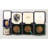A GROUP OF FIVE ATHLETIC AND OTHER MEDALS, boxed.