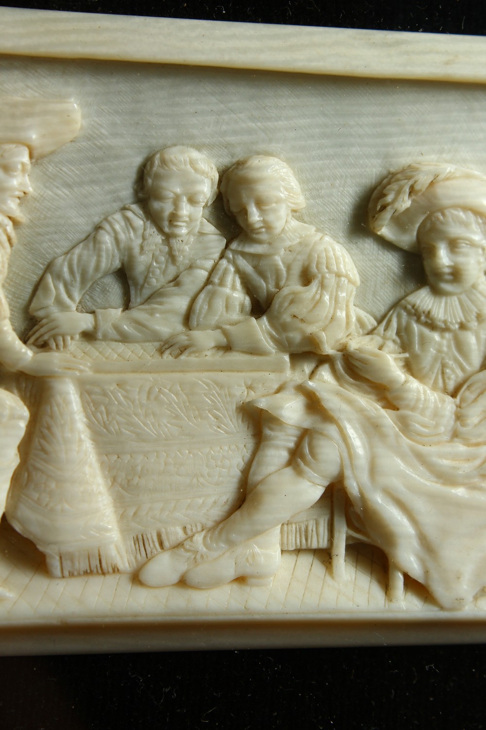 A GOOD SMALL CARVED IVORY PLAQUE, LATE 19TH/EARLY 20TH CENTURY, depicting cavaliers seated around - Image 5 of 7