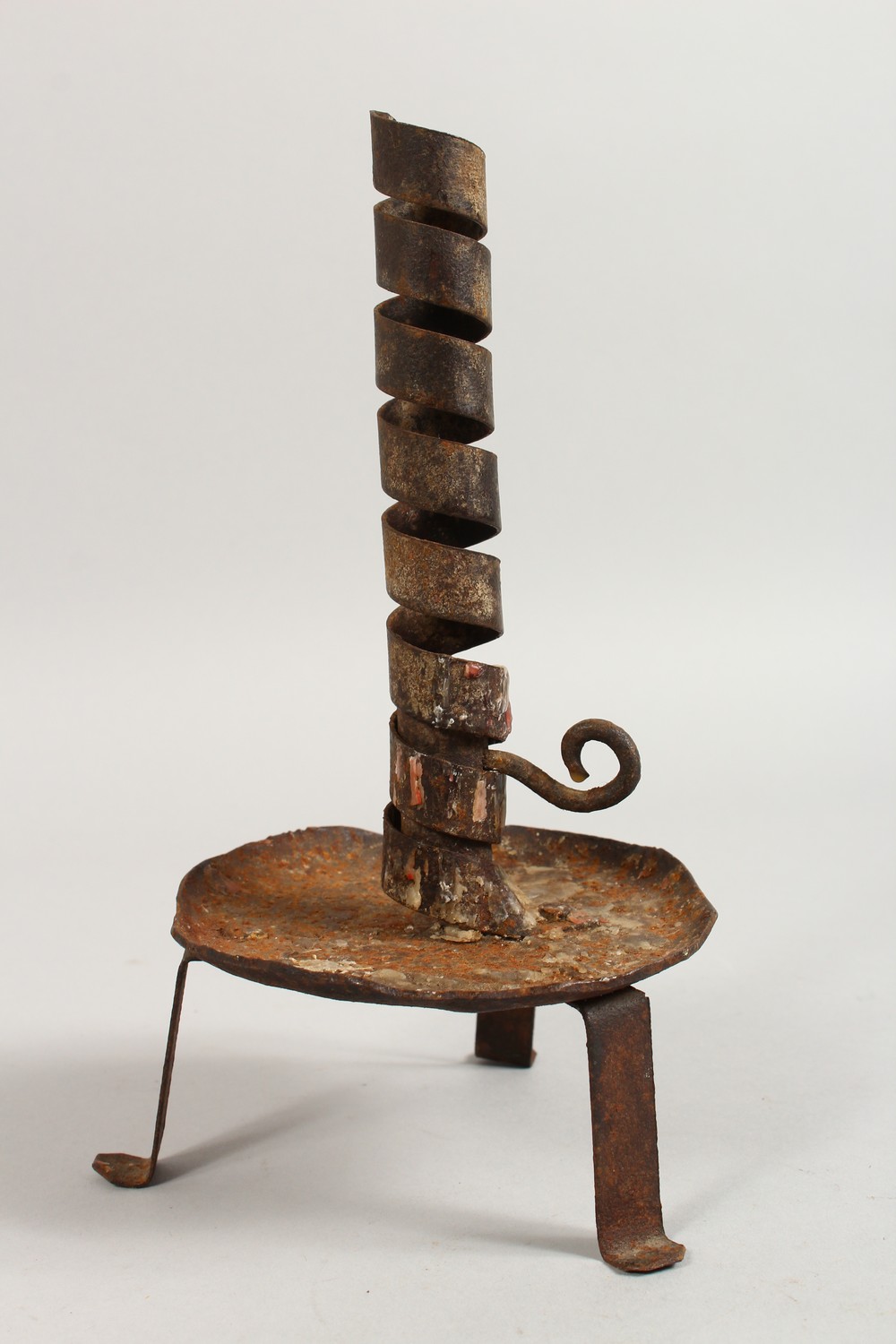 AN EARLY WROUGHT IRON CANDLESTICK. 9.5ins high. - Image 2 of 3