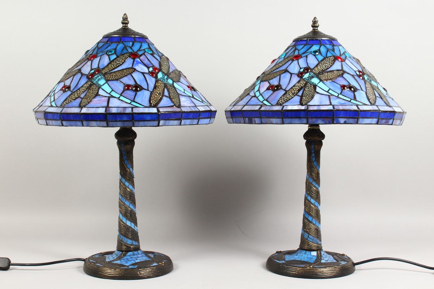 A PAIR OF TIFFANY STYLE TABLE LAMPS, with blue glass shades. 22ins high.