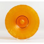 AN ART NOUVEAU ORANGE LUSTRE CIRCULAR GLASS DISH. 12.25ins diameter.