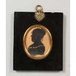 AN OVAL SILHOUETTE OF A LADY, in an ebony frame. 4.75ins x 4ins.