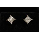 A PAIR OF 14CT WHITE GOLD DIAMOND STUD EARRINGS of 1CT.