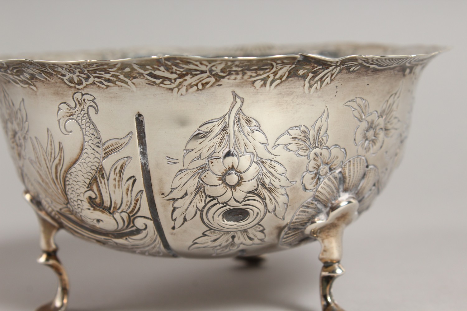 A VICTORIAN CIRCULAR SUGAR BOWL, repousse with birds, animals etc., on three pad feet. 4.75ins - Image 3 of 10