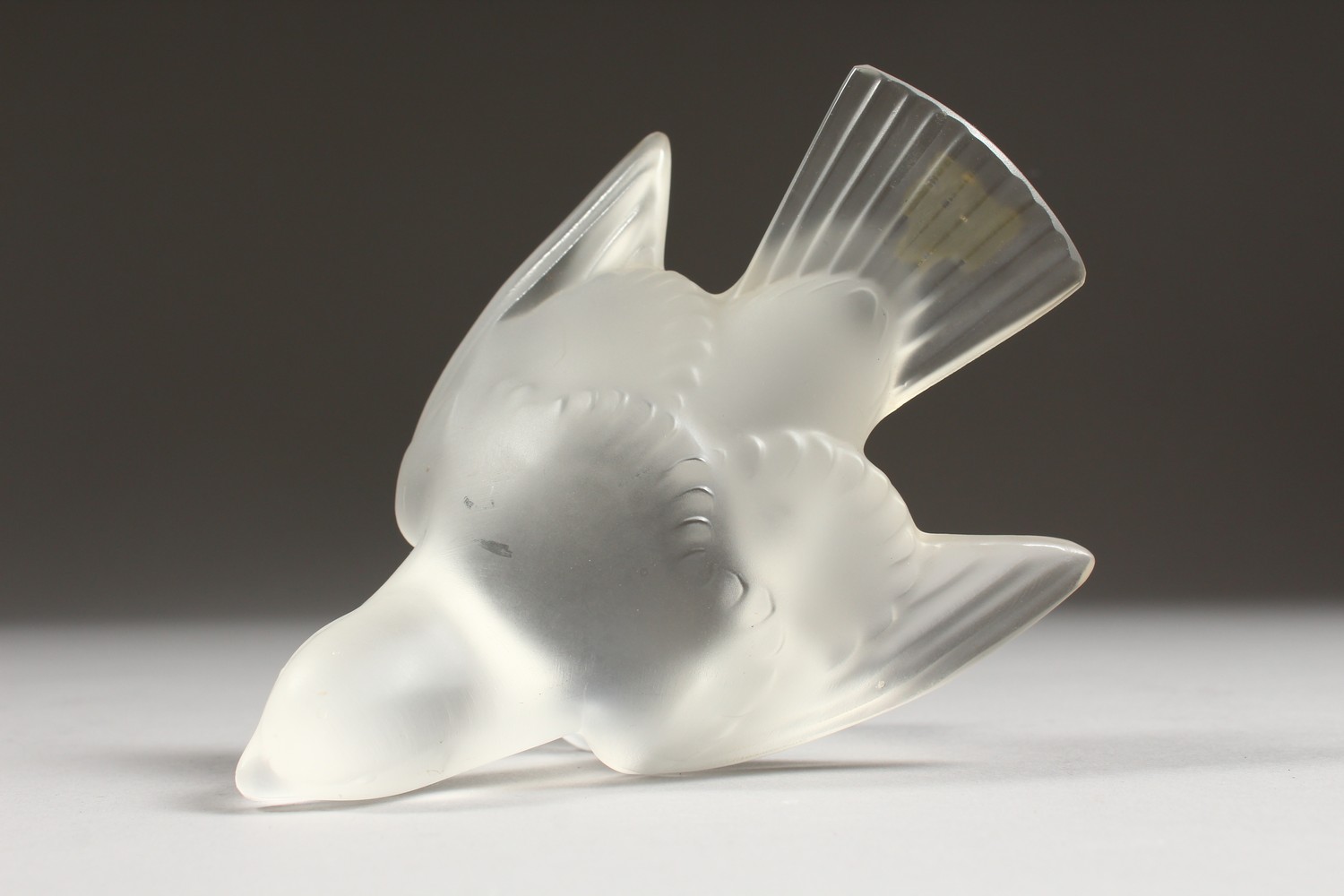 A LALIQUE FROSTED GLASS MODEL OF A BIRD, wings outswept, (base chipped). 5ins long. - Image 5 of 7