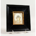 A 19TH CENTURY OVAL PORTRAIT MINIATURE, possibly South American, of a young lady wearing a hat.