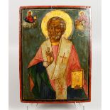 AN EARLY RUSSIAN ICON, on a wooden panel. Priest, dated 1853. 14ins x 11ins.