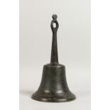 AN OLD HAND BELL, with wrought iron handle. 10ins high.